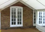 Marquee Joined to House